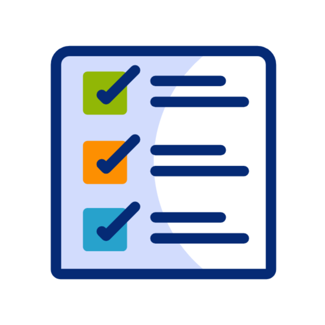 Engineers using a laptop to analyze software data in an industrial workshop setting.